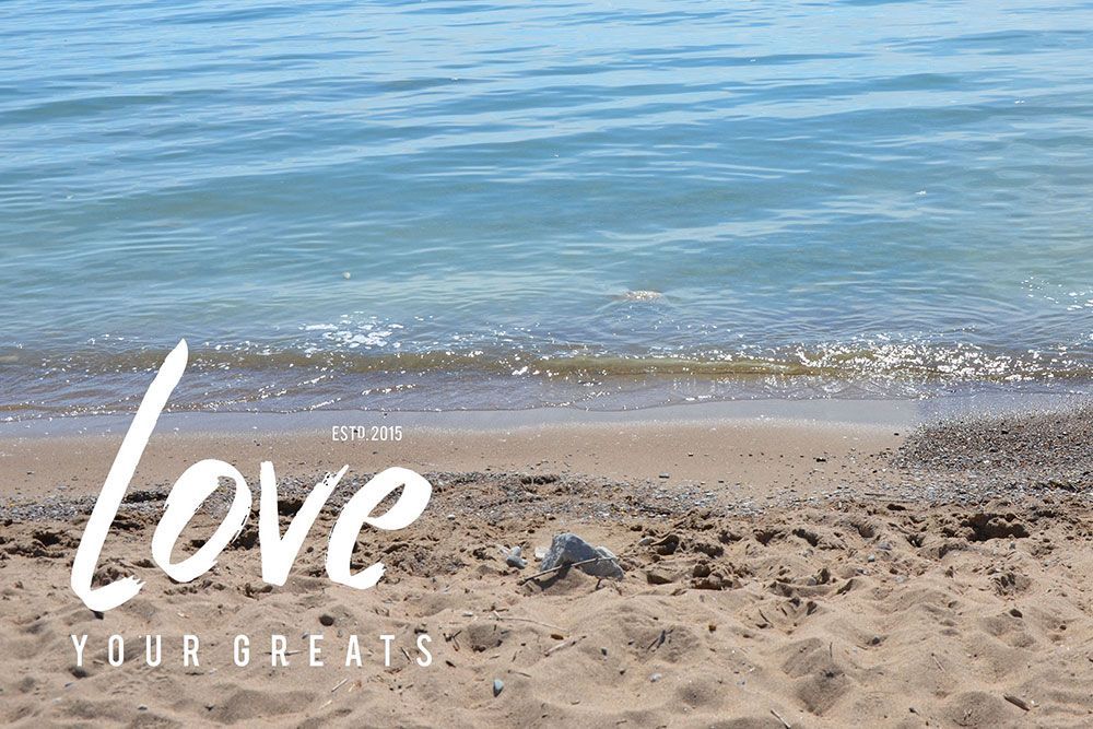 A photo of Lake Huron with Love Your Greats wordmark logo superimposed.